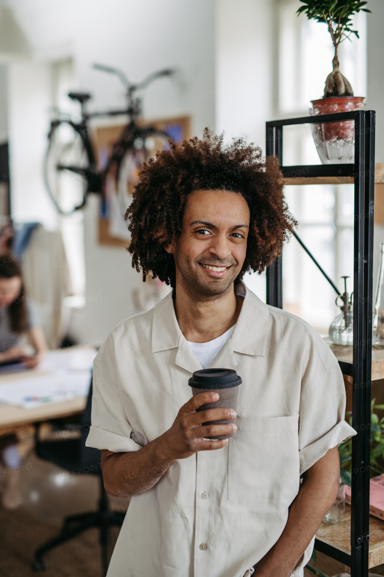 Portrait of young multiracial man in an office.