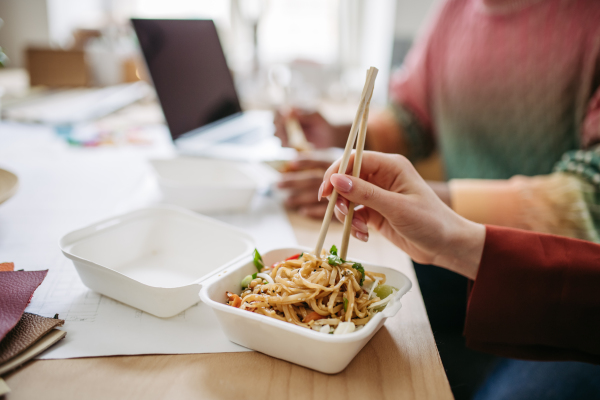 Close up of chinese food, lunch time in the office.