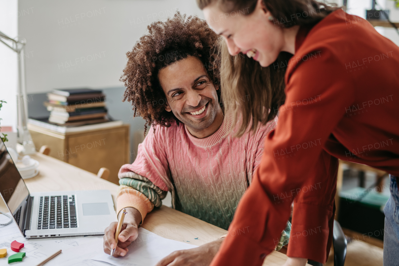 Young colleagues working together in a startup company.