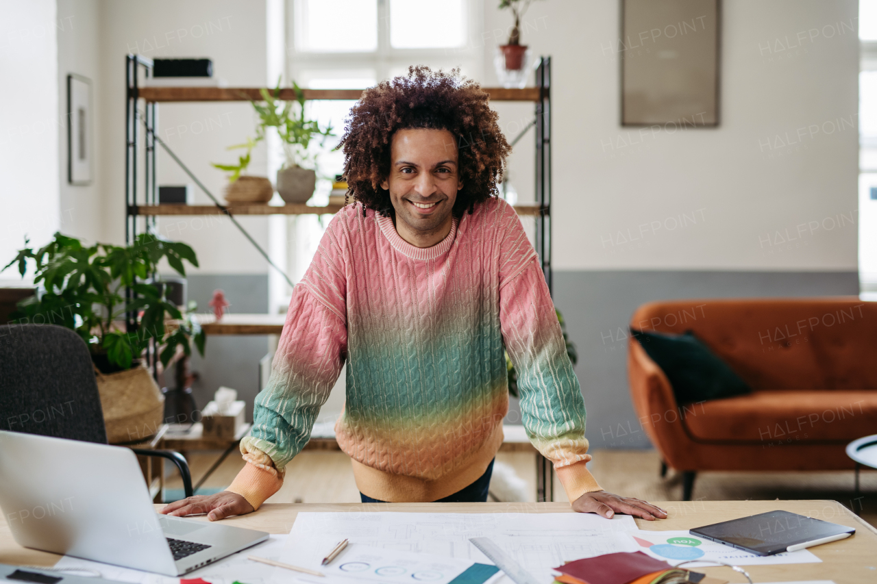 Portrait of young multiracial man in an office.