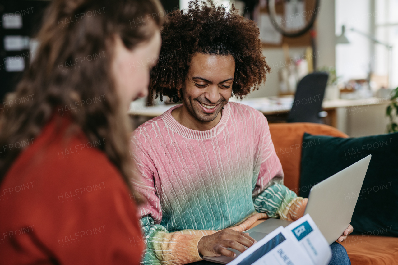 Young colleagues working together in a startup company.