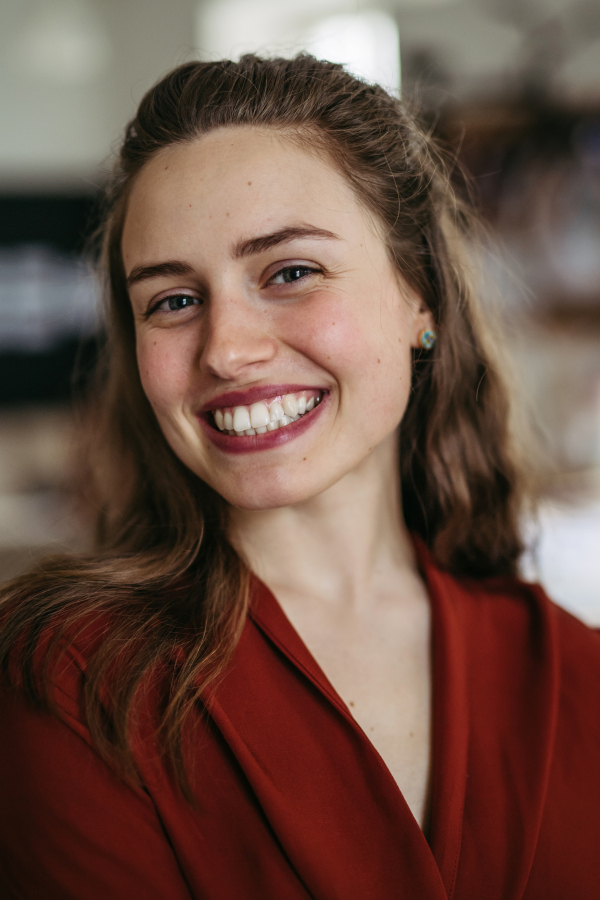 Portrait of young smiling woman in office.