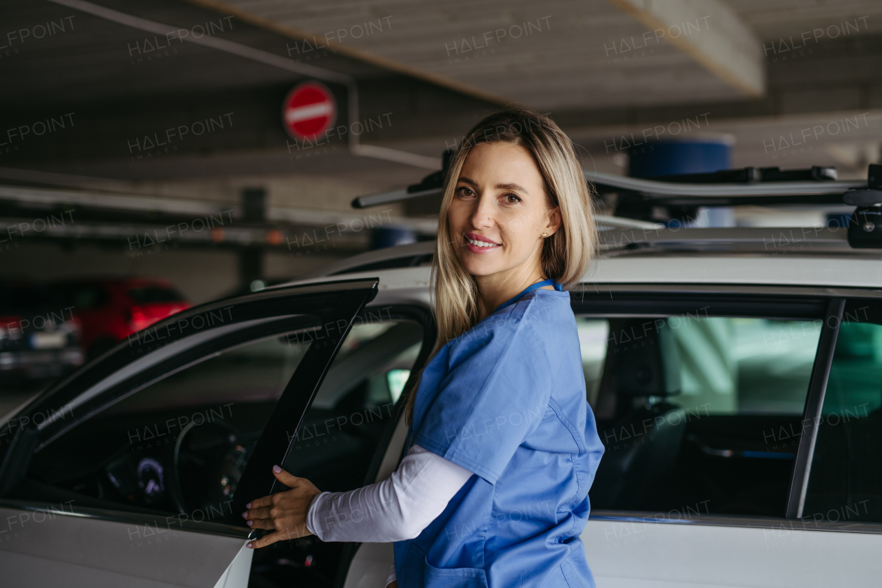 Female nurse getting into car, going home from work. Female doctor driving car to work, on-call duty. Work-life balance of healthcare staff.