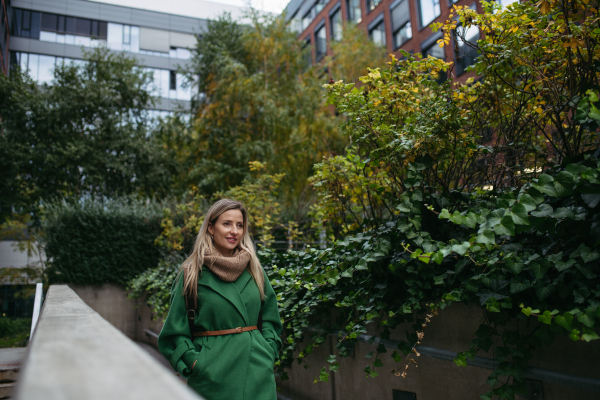 Female nurse or doctor going home from work, enjoying springtime. Work-life balance of healthcare worker.