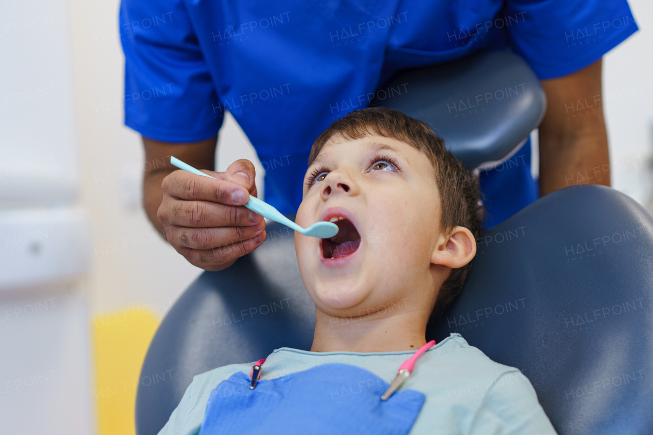 Portrait of a liitle boy during dentist examination.