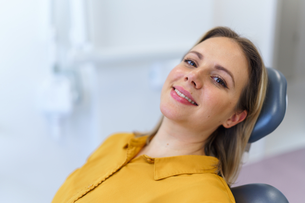 Portrait of young woman in a dentist chair.