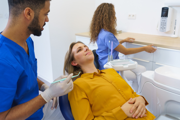 Dental examination of young woman at a dental clinic.