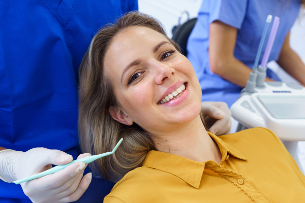 Portrait of young woman in a dentist chair.