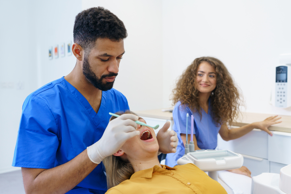 Dental examination of young woman at a dental clinic.