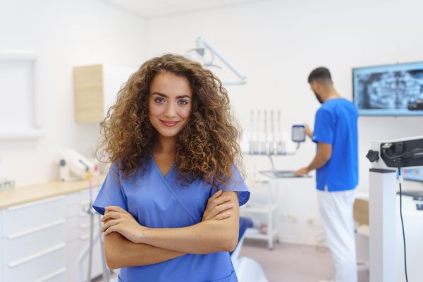 Portrait of young woman dentist at a private dental clinic.