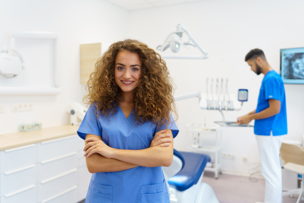 Portrait of young woman dentist at a private dental clinic.