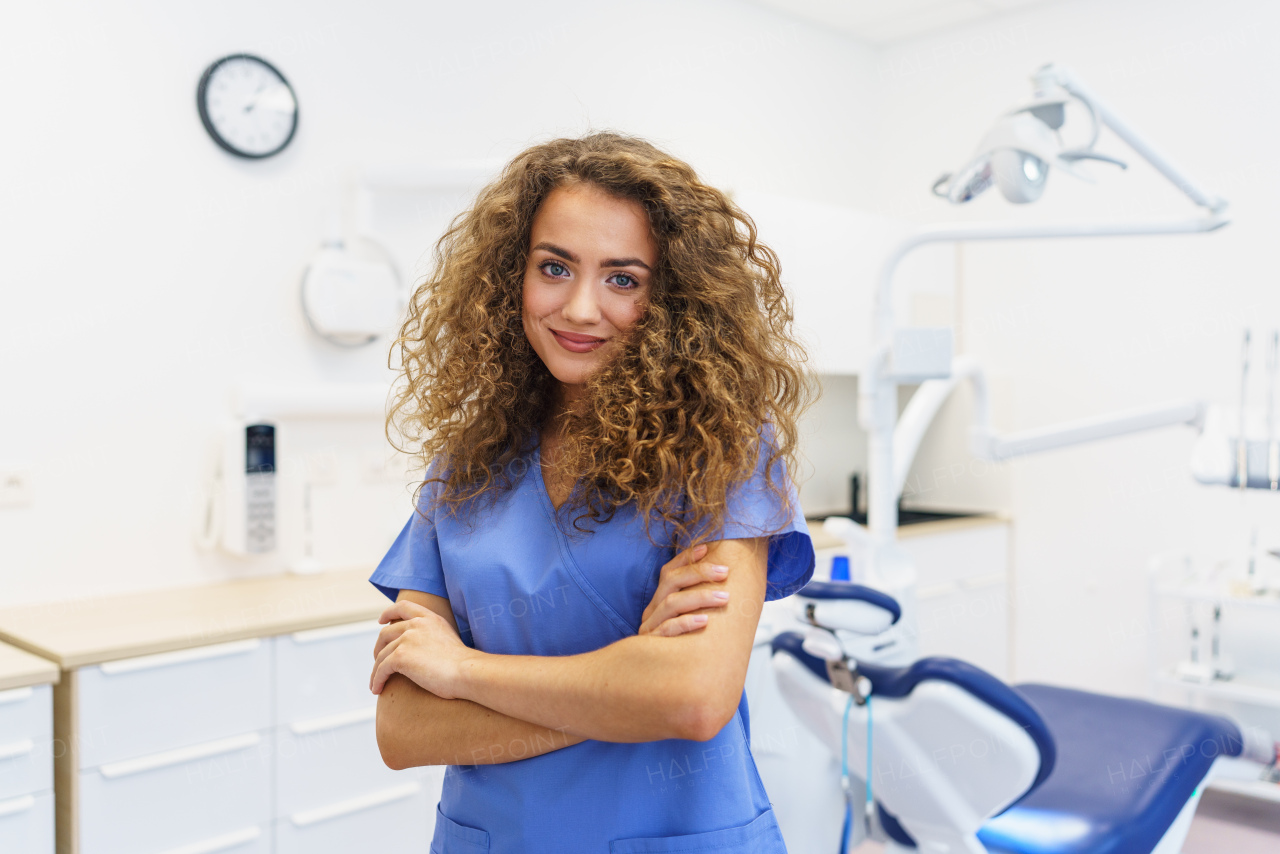 Portrait of young woman dentist at a private dental clinic.