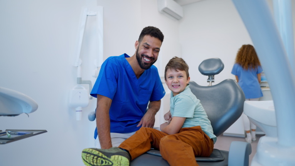 Video of a liitle boy during dentist examination, looking at camera.