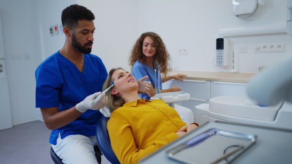 Dental examination of young woman at a dental clinic.