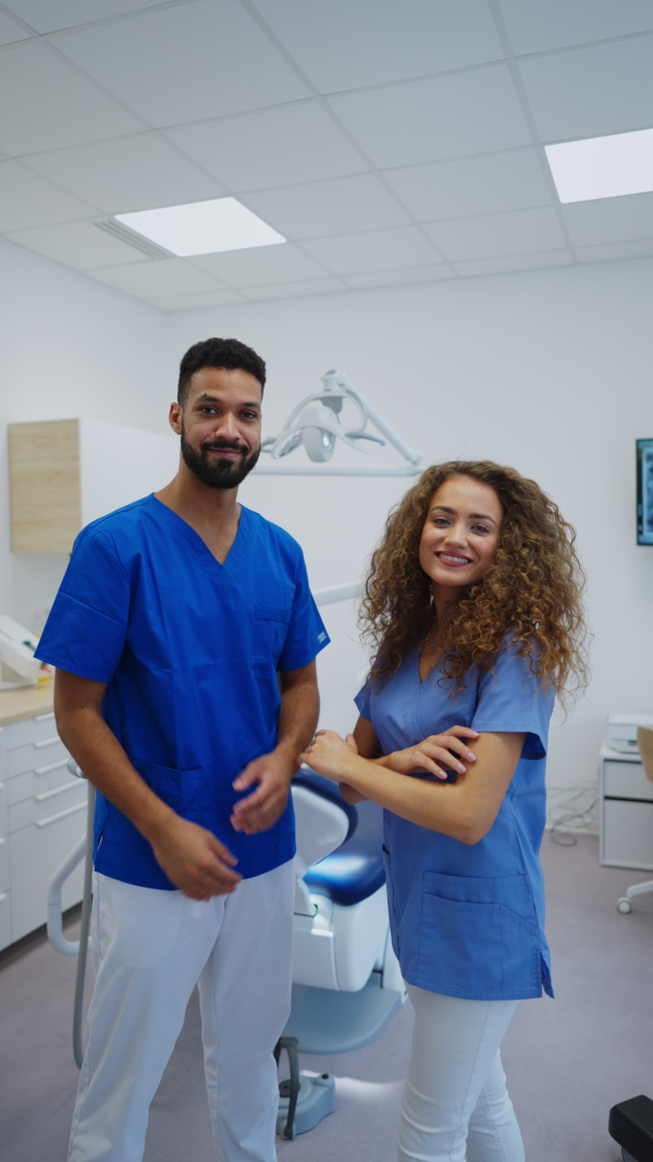 A video of young dentists at private dental clinic. Vertical footage.