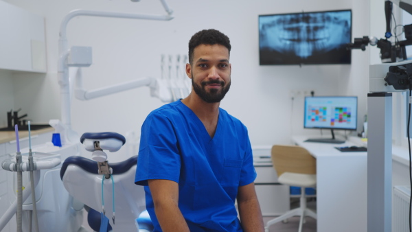 A video of young multiracial dentist at a private dental clinic.