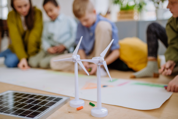 Close-up of model of wind turbine at the school lesson.