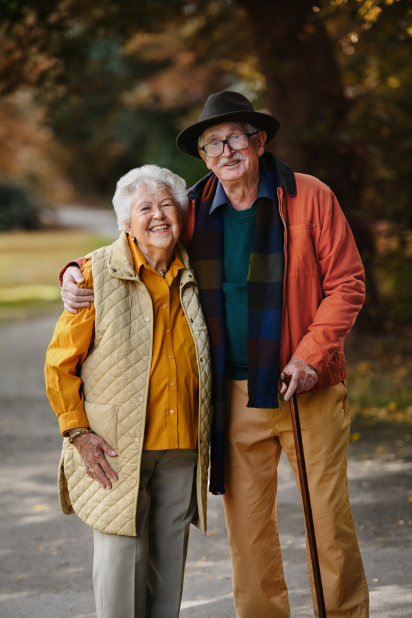 Full lenght portrait of senior couple in love at walk in a park.