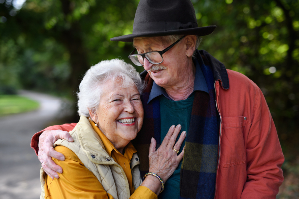 Portrait of senior couple in love at walk in a park.