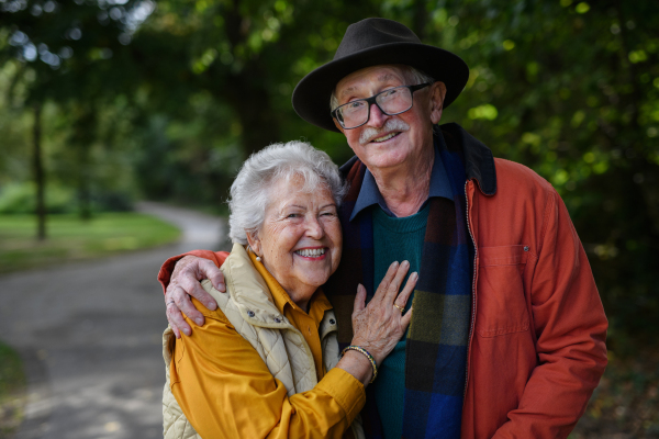 Portrait of senior couple in love at walk in a park.