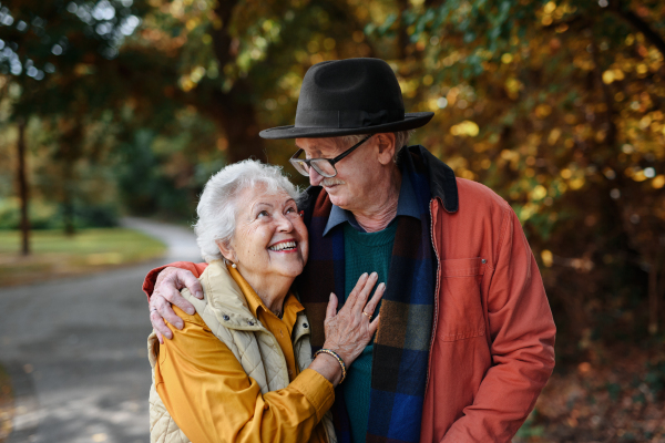 Portrait of senior couple in love at walk in a park.