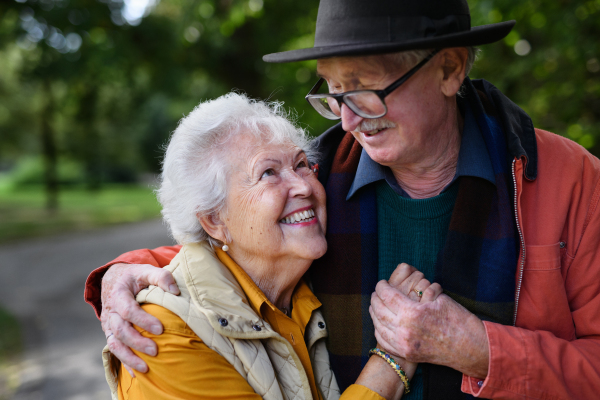 Portrait of senior couple in love at walk in a park.