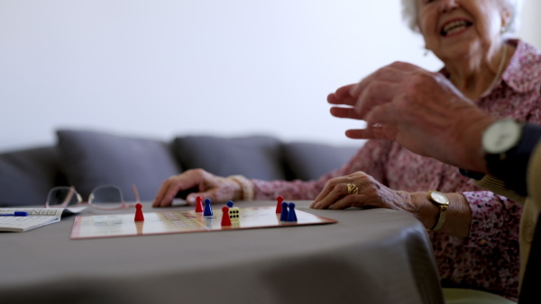 Video of senior couple playing board games at home. Senior couple in love.