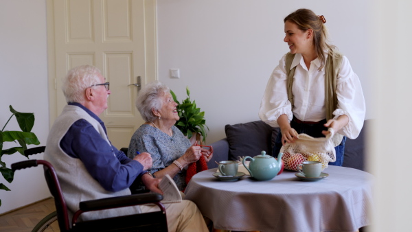 Video of daughter visiting her senior parents at home and enjoying time together.