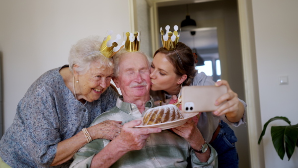 Video of daughter visiting her senior parents at home and celebrating birthday.