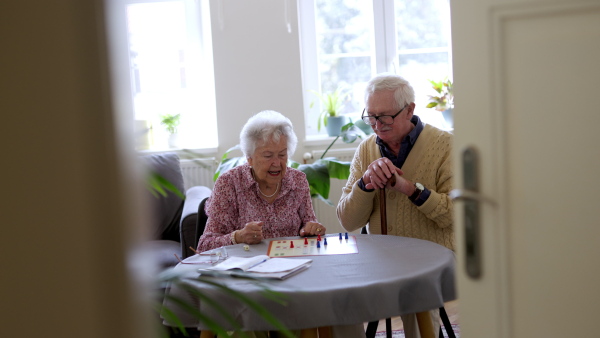 Video of senior couple playing board games at home. Senior couple in love.