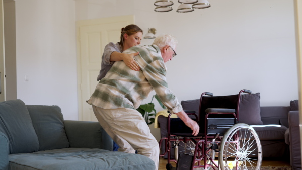 Video of daughter visiting her senior father and taking care of him.