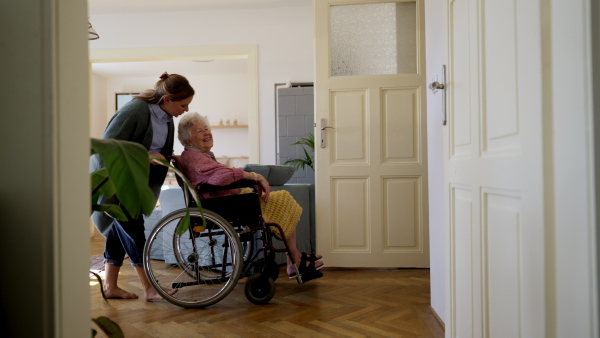 Video of daughter visiting her senior mother and taking care of her.