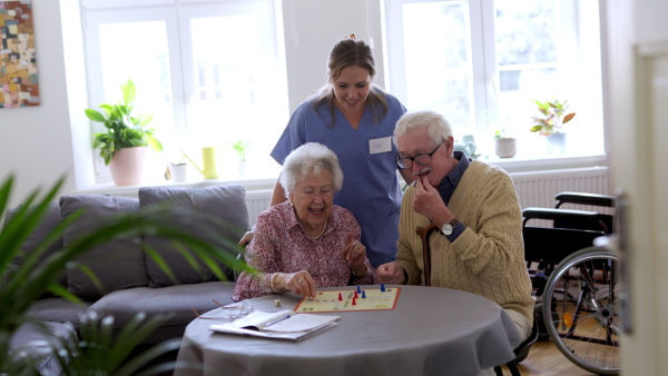 Video of senior couple playing board games at nursing home. Senior couple in love.