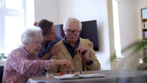 Video of senior couple playing board games at nursing home. Senior couple in love.