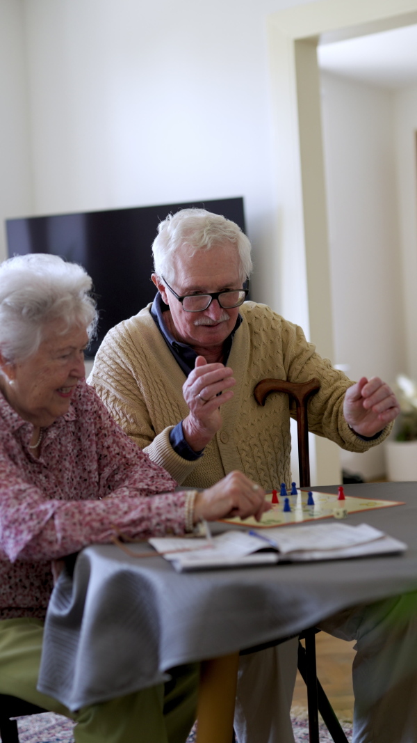 Video of senior couple playing board games at home. Senior couple in love.