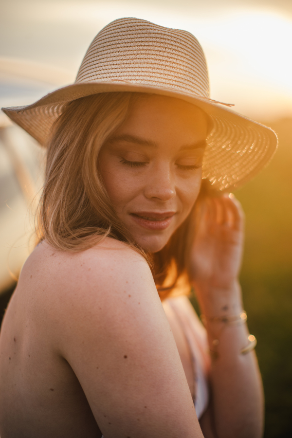 Portrait of a beautiful woman outdoor during sunset.