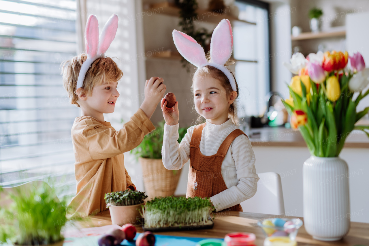 Little kids with bunny ears celebrating easter and spring.