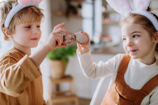 Little kids with bunny ears celebrating easter and spring.