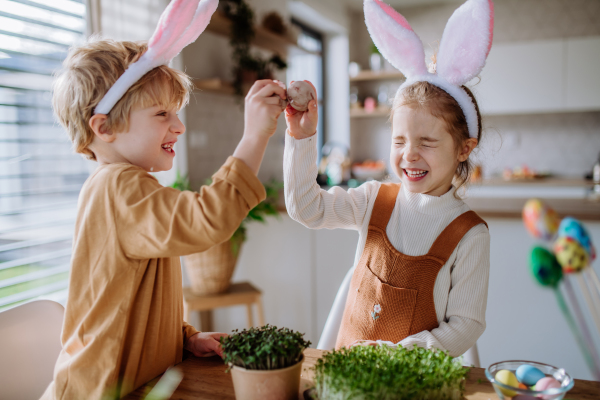 Little kids with bunny ears celebrating easter and spring.