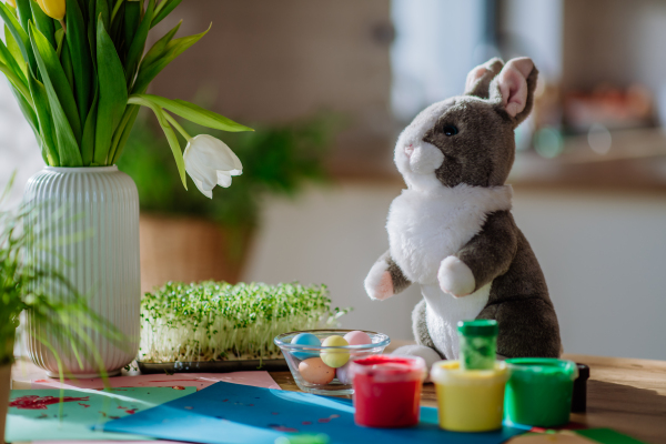 Close up of a bunny soft toy with Easter decoration.