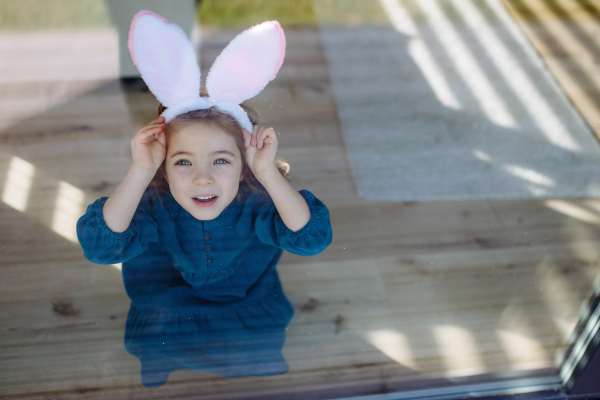 High angle view of girl with bunny ears.