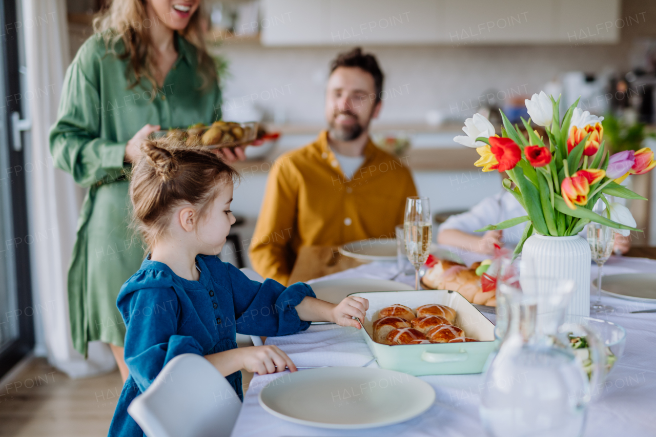 Happy multigenertional family having Easter lunch together.