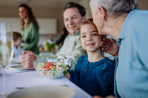 Happy multigenertional family having Easter lunch together.