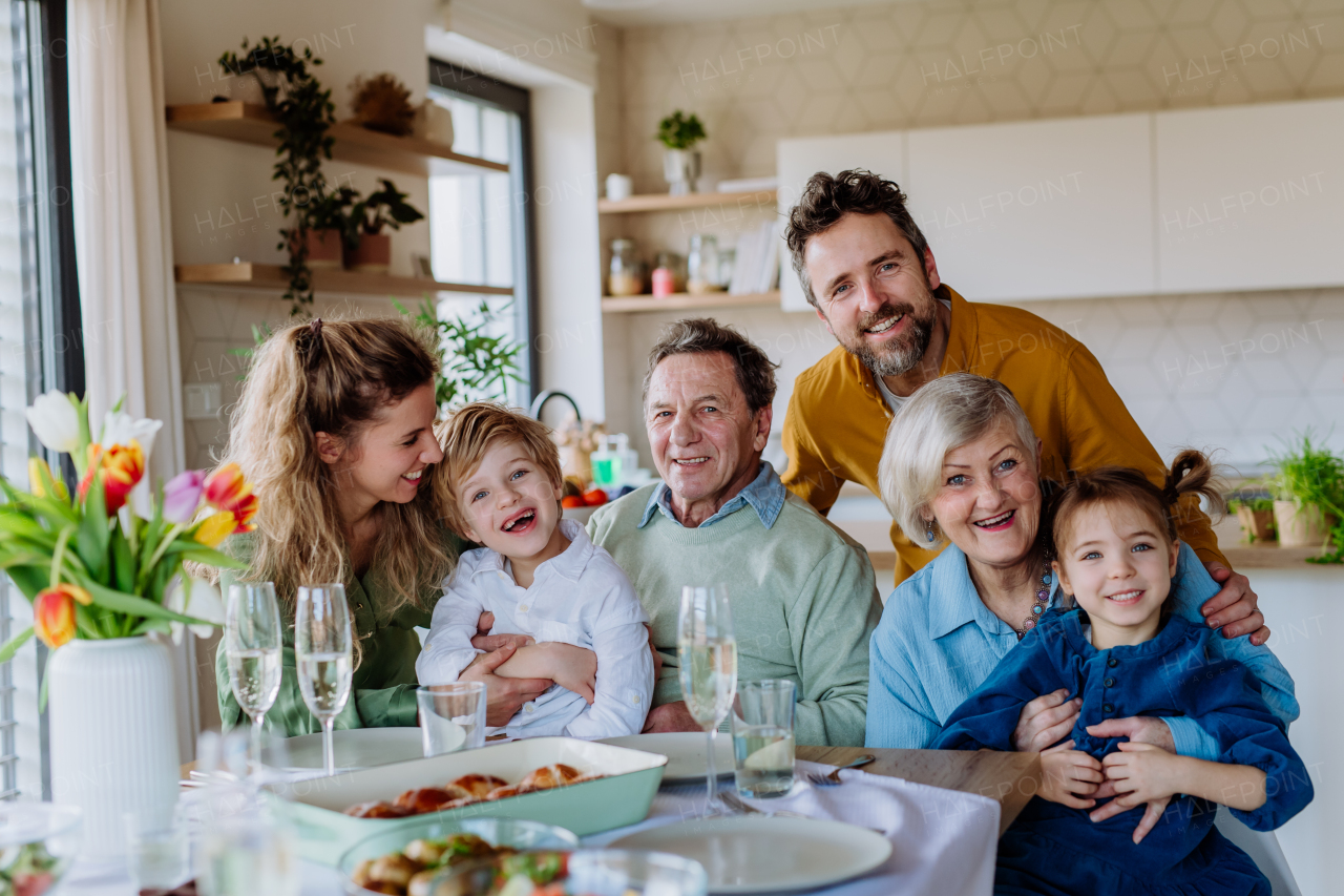 Portrait of happy multigenerational family during Easter lunch.