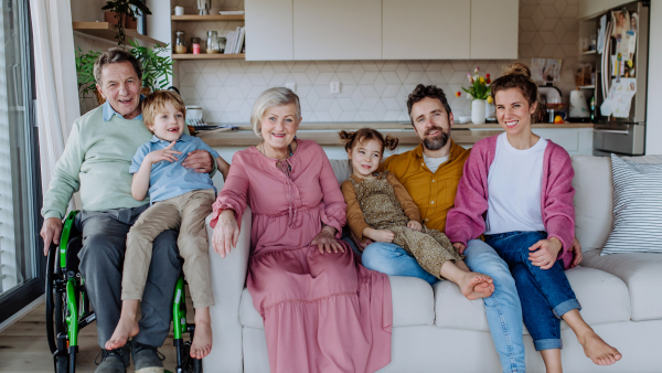 Portrait of happy multigenerational family in their three generation house.