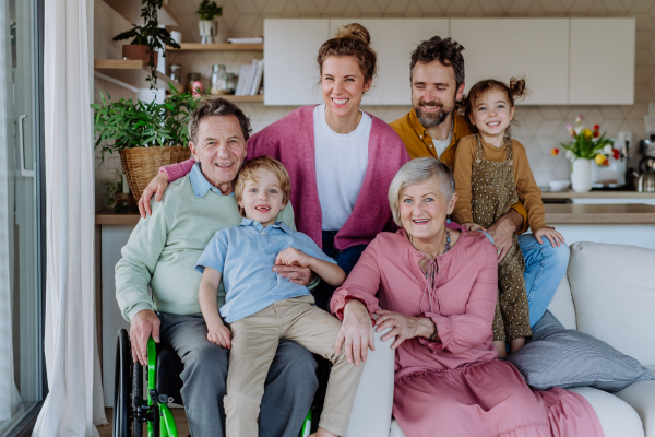 Portrait of happy multigenerational family in their three generation house.