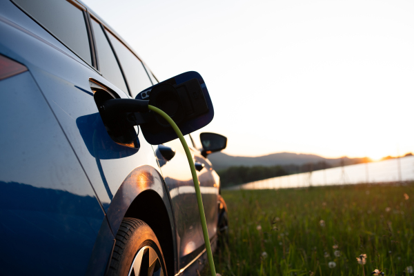 Close up of an electric car charging, concept of ecology and sustainability.