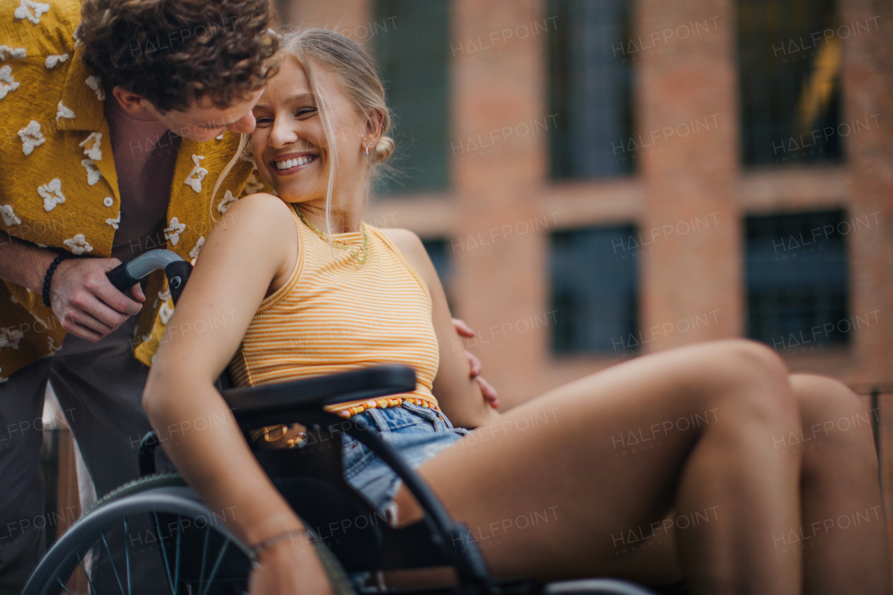 Beautiful gen Z girl in a wheelchair with her boyfriend. Inclusion, equality, and diversity among Generation Z.