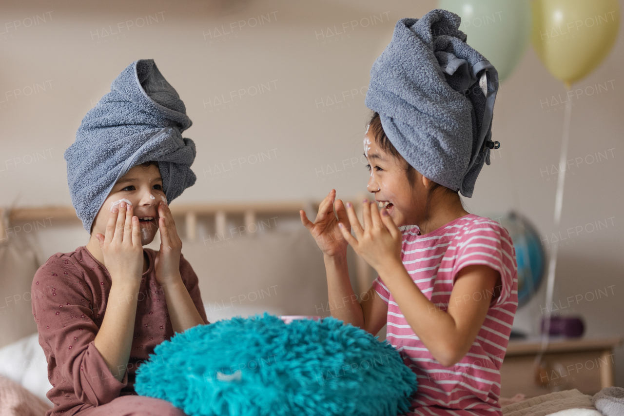 Little girl having fun during a skincare routine.