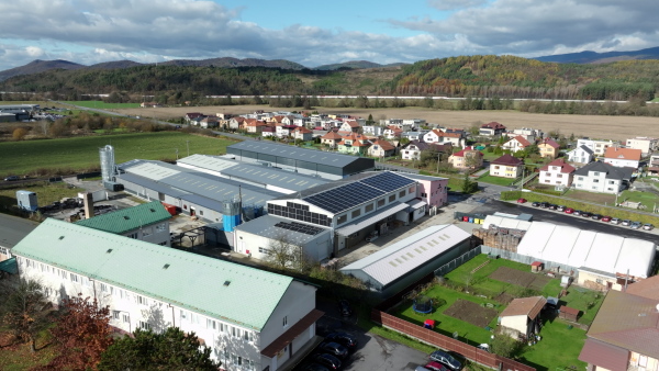 Aerial view of a solar panels on rooftop of factory. Solar energy as renewable energy source in business.